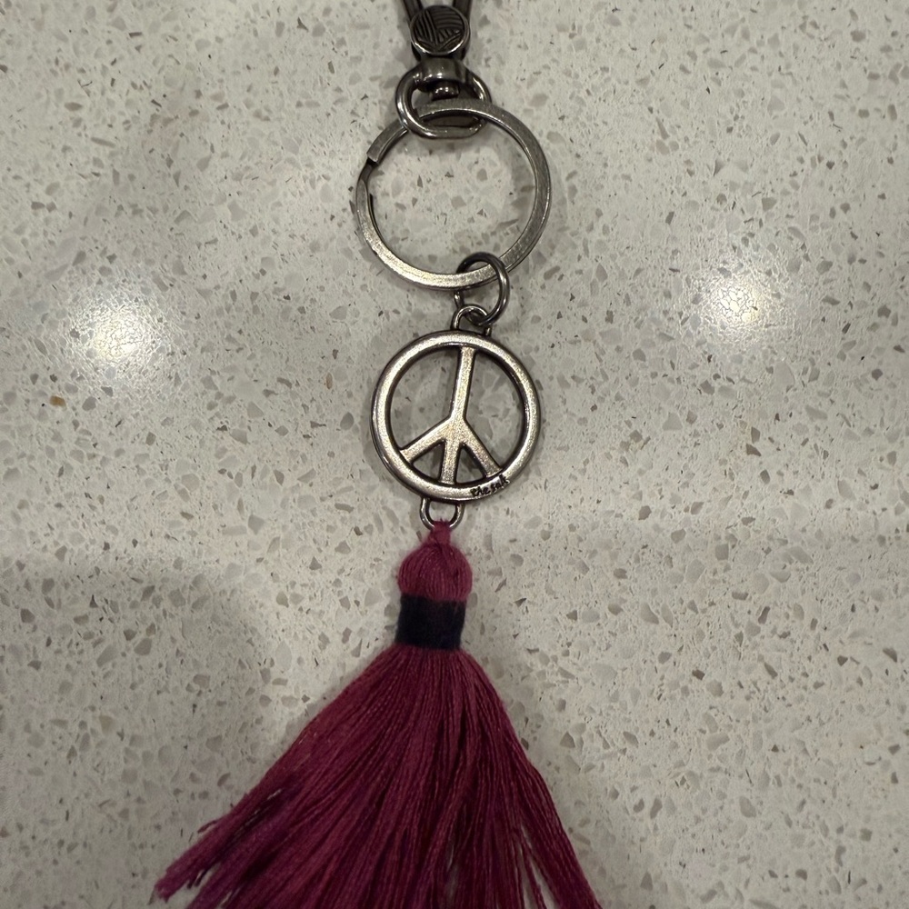 Silver Peace Sign Keychain with Purple Tassel the sak